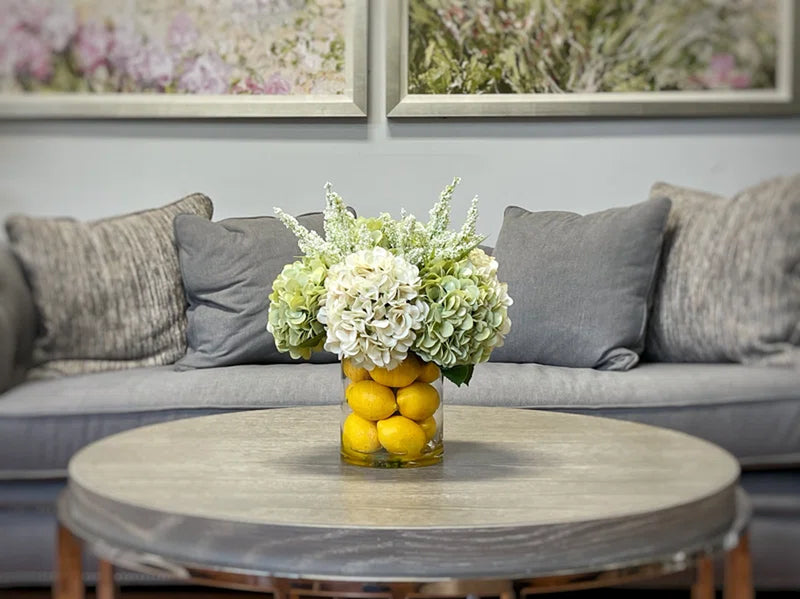 Hydrangeas Arranged in Glass Vase with Lemons