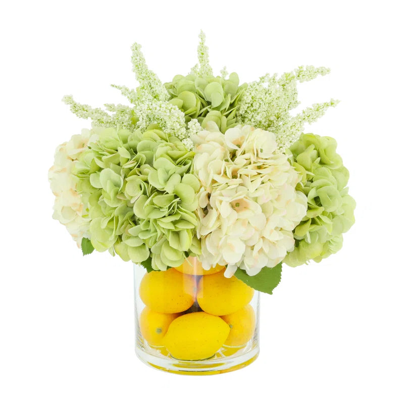 Hydrangeas Arranged in Glass Vase with Lemons